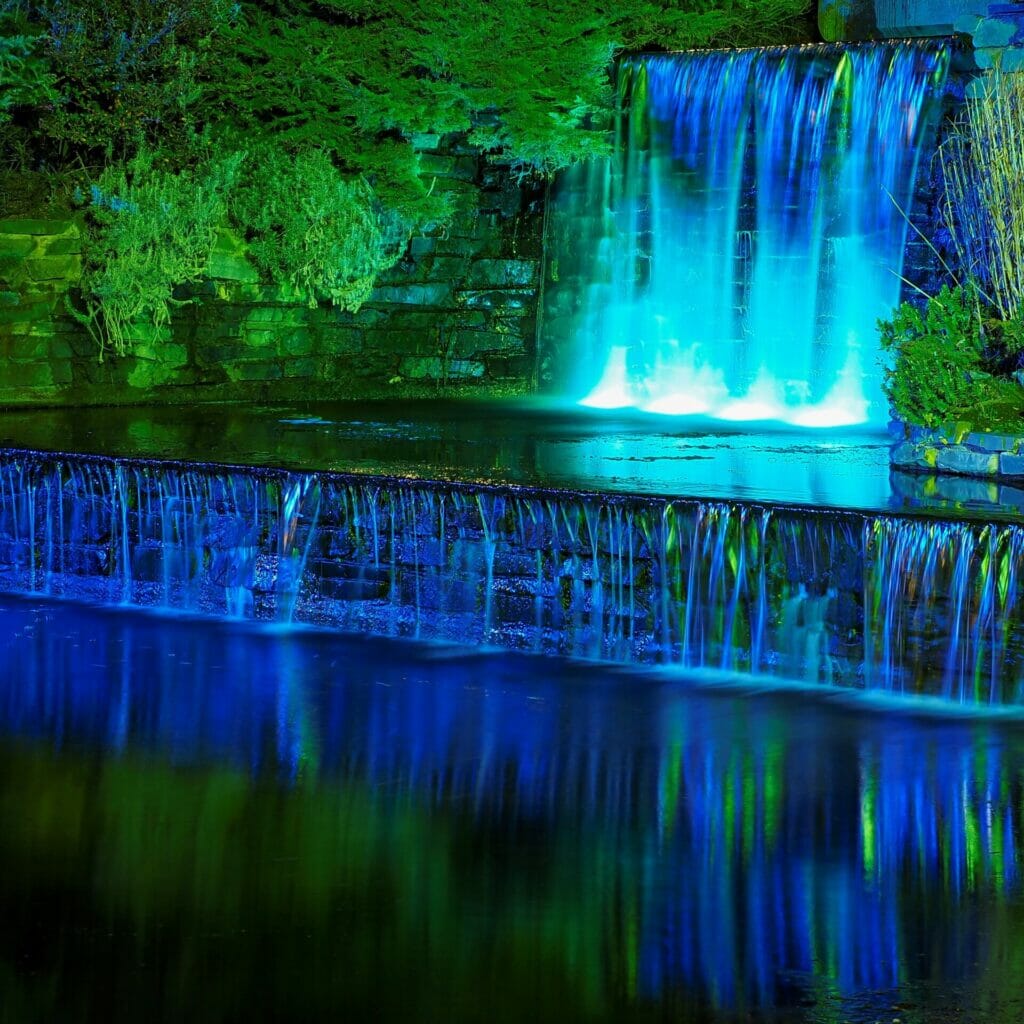 Photo or man-made water feature lit up with coloured lights - taken on a Low-Light and Long Exposure Photography - Rhyl - Roving Academy Evening workshop