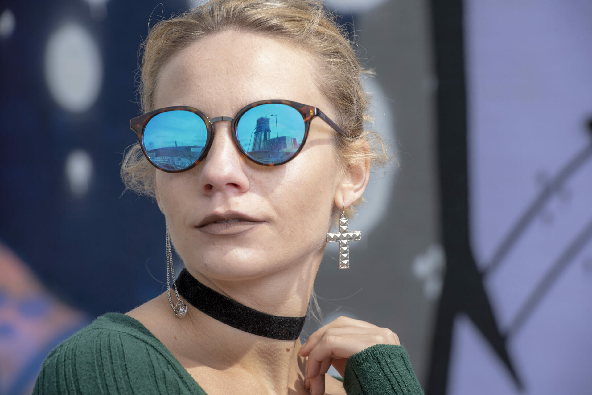 Colour photo of young lady with sunglasses showing reflection of a funfair at the beach -Piers and Portraits - Welshot photographic Academy Evening