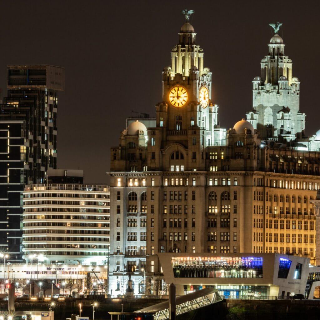 Photo taken at night of the Liverpool Skyline showing historic buildings shot from Birkenhead Liverpool Skyline & Low-Light Photography 