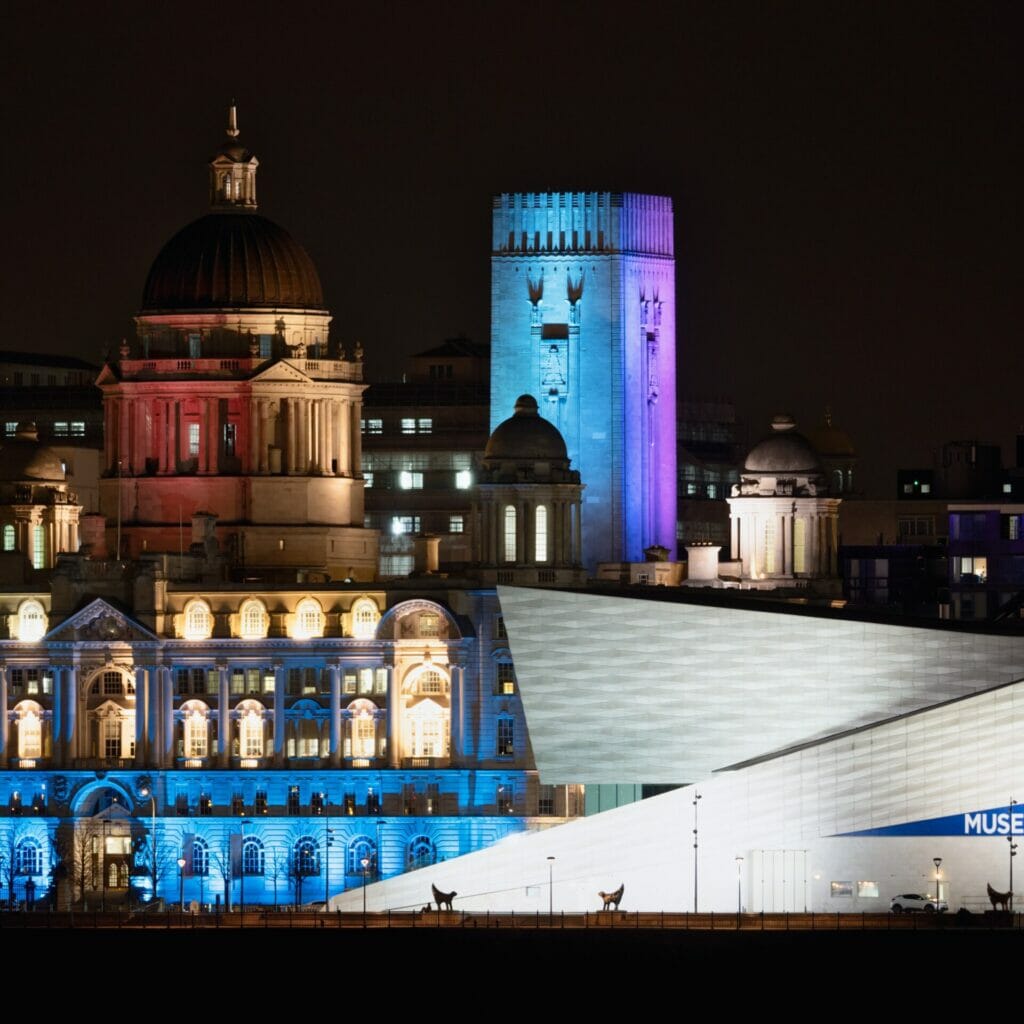 Photo taken at night of the Liverpool Skyline showing historic buildings shot from Birkenhead Liverpool Skyline & Low-Light Photography 