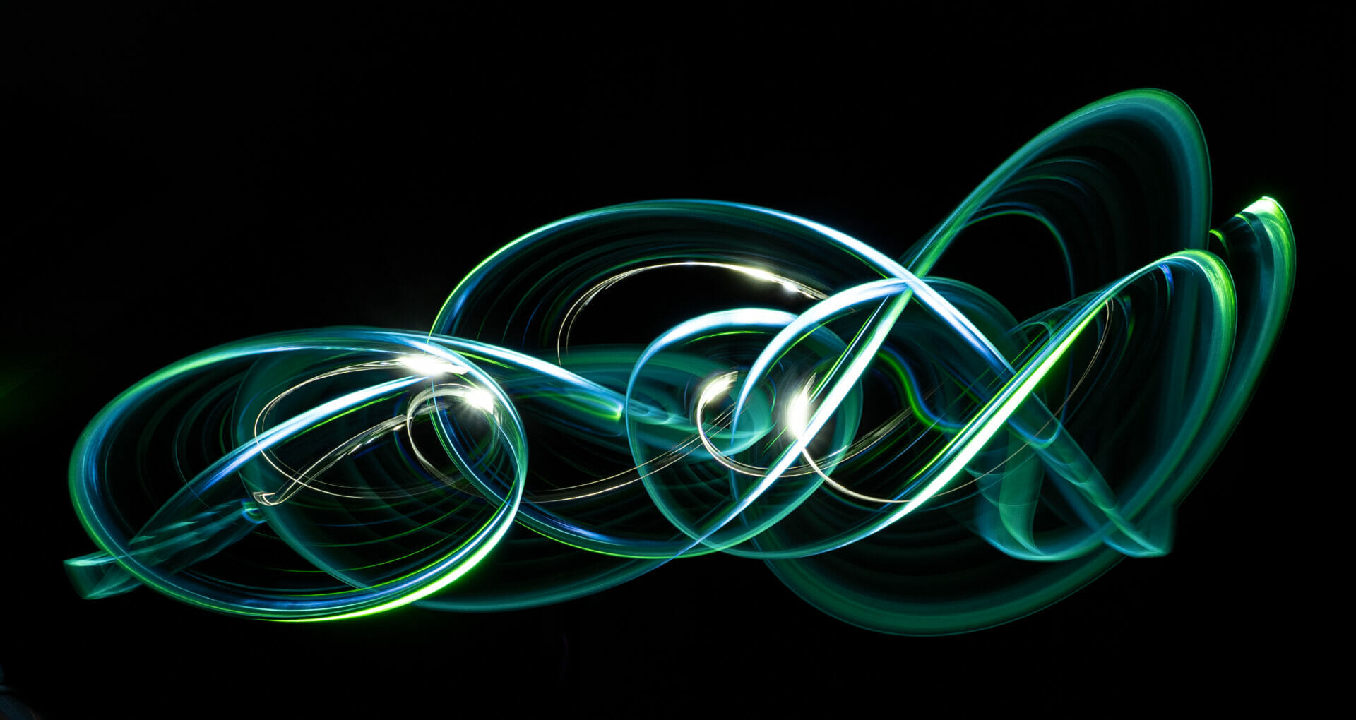 Photo made by waving a  green light around in the dark to showcase the techniques for Long Exposure Photography - Light Painting Techniques - Chester Academy Evening