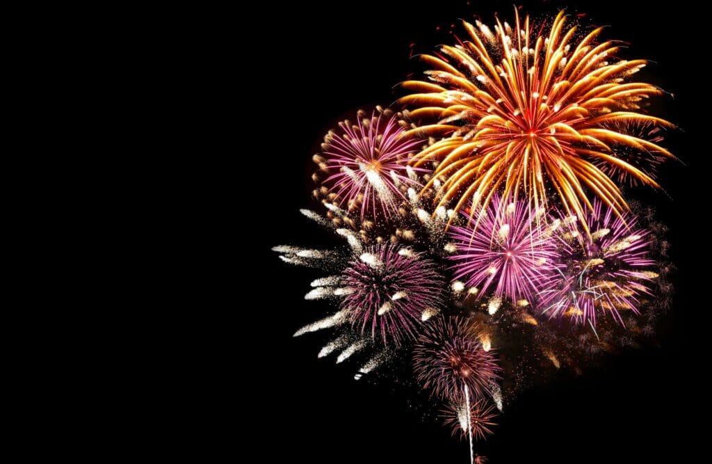 Photo of Fireworks cascading in the night sky