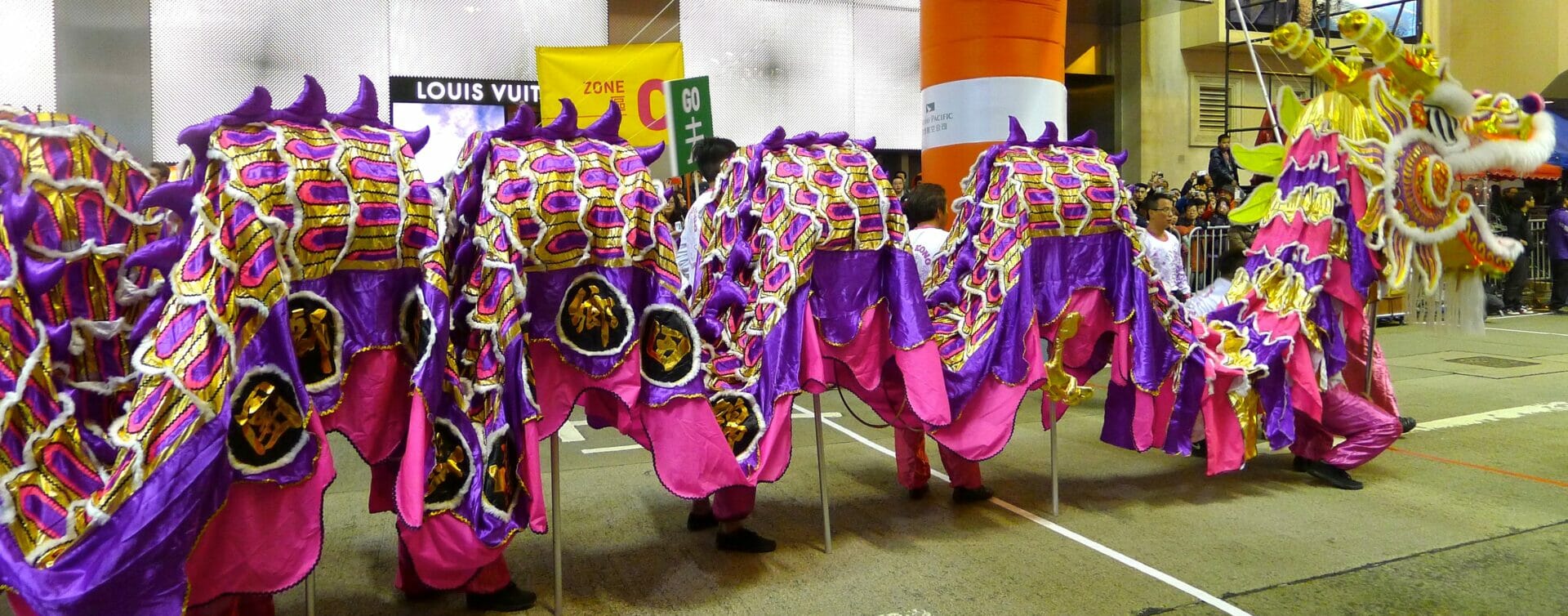 Street Photography Meets Chinese New Year - Photo of a pink and purple Chinese Dragon during a Chinese New Year Parade