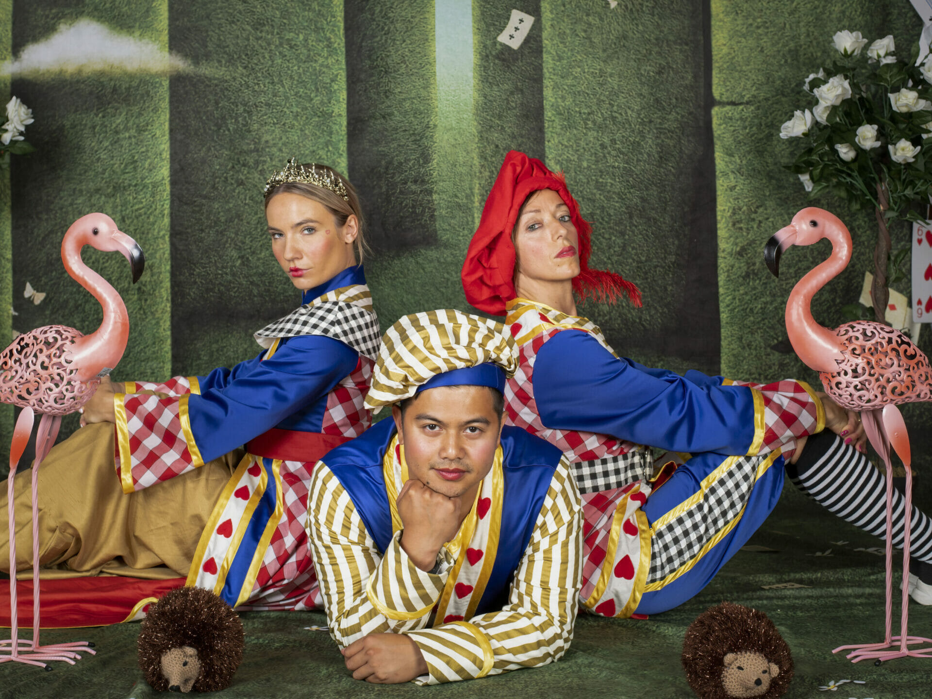 Photographic Themed Photo-Shoot - Mad Hatters and Alice in Wonderland. Photo is of two female models as the Queen of Hearts and King of Hearts and the Male Model is the Knave of Hearts